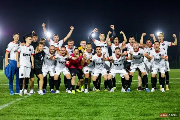 Футбольная команда под прожекторами